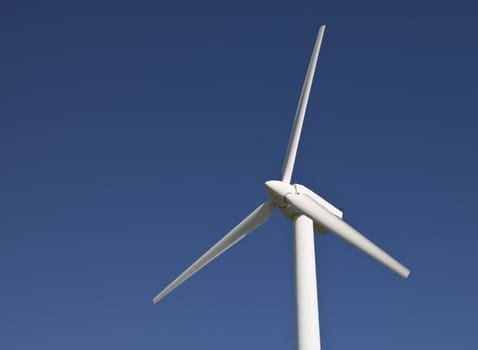 Wind power station towards blue sky