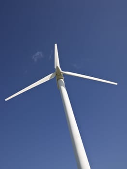 Wond power station towards blue sky