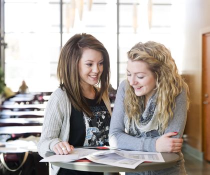 two girls studying