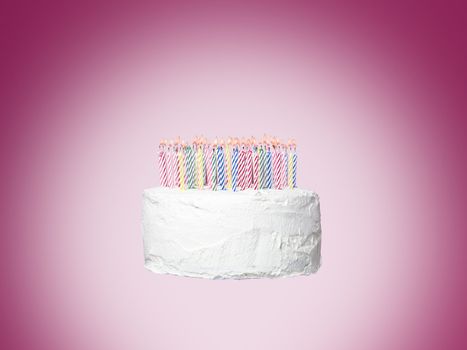 Cake with candles towards pink background