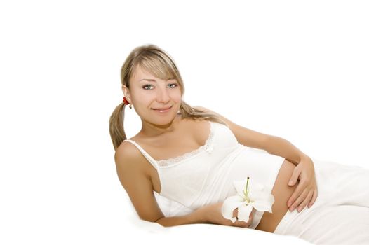 Smiling pregnant woman with flower over white, second trimester