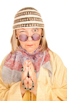 Crazy new age woman with beads in a yellow robe