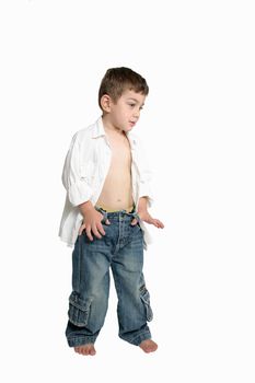 Child with attitude, standing with thumbs hooked in beltloops