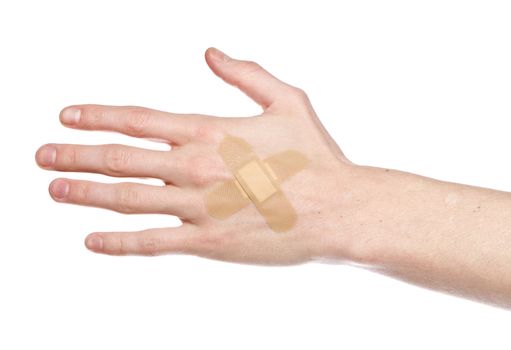 Hand with bandaid isolated on a w hite background