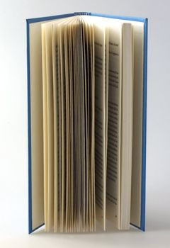 Closeup of pages of a book over lite background