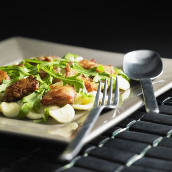pasta orecchiette with meat noodles and rucola