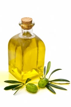 olive oil and olives on white background
