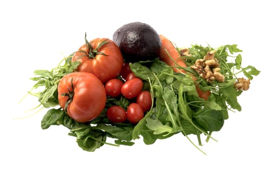 Fresh salad ingredients isolated against a white background.