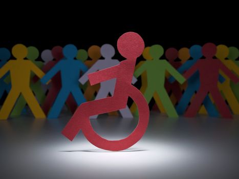 A disable paper figure stands under the spotlight on his wheelchair.