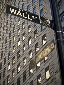 A Wall Street sign when it crossover with Broadway in Manhattan New York.