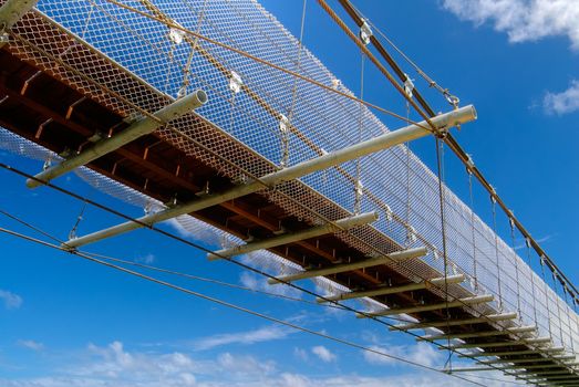 Beautiful bridge with blue sky and white clouds in the outdoor.