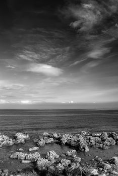Beautiful landscape coral reef rock ocean and amazing sky and clouds.