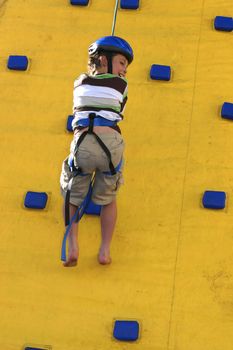 Abseilling down a climbing wall