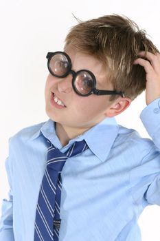 A boy scratching his head for an answer.