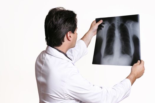 A doctor examining an x-ray