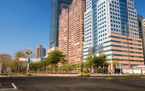 City street scenery with empty road and beautiful buildings in Kaohsiung, Taiwan.