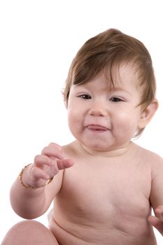 Cute little baby girl reaching out to grab something