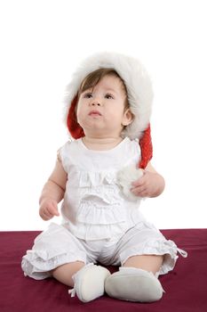 Cute little baby girl sitting on white background