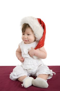 Sweet little baby girl with christmas hat