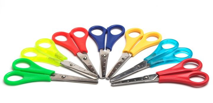 Some colored scissors over white