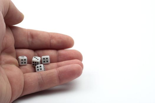 Dices in hand over white background