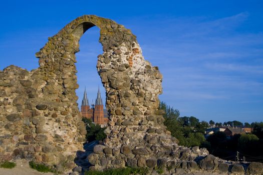 In a hole of the destroyed wall is visible the church