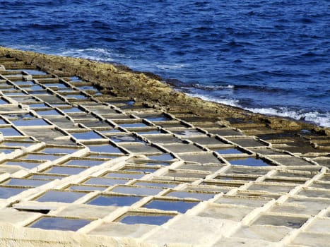 Saltpans on the island of Malta, found in various localities on rocky shores. Left over from the Roman Empire era.