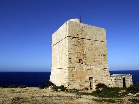 Medieval defense tower situated in a strategic defensive location, in Malta