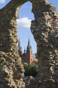 In a hole of the destroyed wall is visible the church