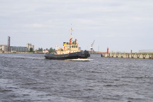 One of tugboats near the ferry terminal in the harbor in Ventspils, Latvia.