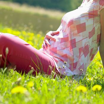 pregnat woman on meadow