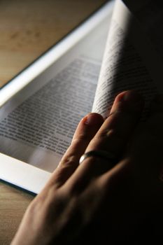 opened pages of a book on wooden table