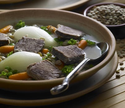 beef soup with vegetables and lentils