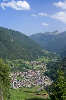 aerial view of Pejo valley in summer ,Trentino, Italy with the characteristic small town of Cogolo. Photo taken with polarized filter