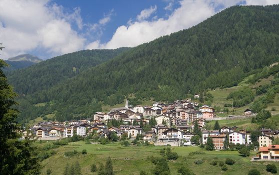 summer view of Vermiglio, characteristic small town in Italian alps