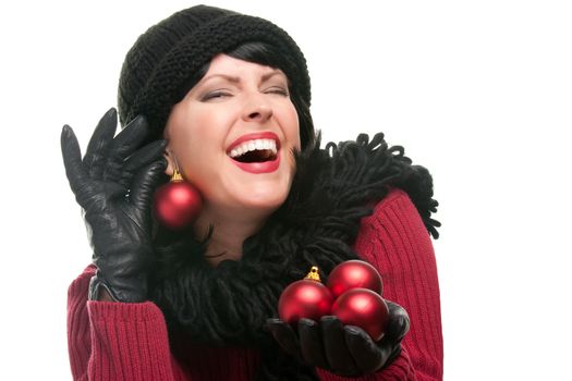 Attractive Woman Holding Christmas Ornaments Isolated on a White Background. 