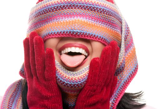 Attractive Woman With Colorful Scarf Over Eyes Sticking Out Tongue Isolated on a White Background.