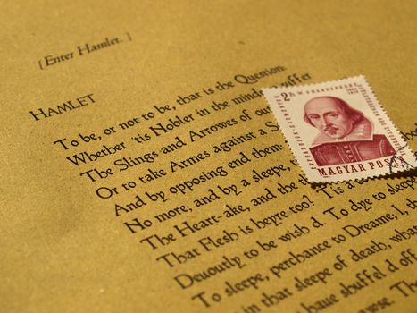 William Shakespeare's Hamlet (original Middle English text from the First Folio of 1623) with stamp - selective focus
