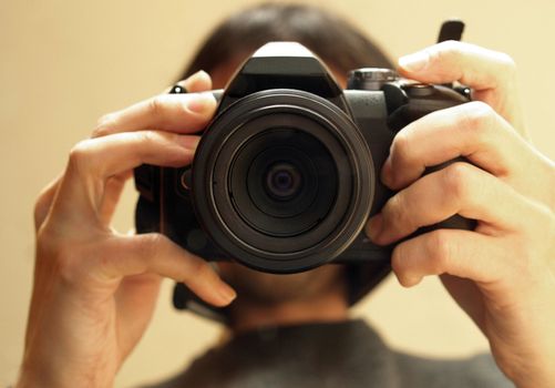 Self portrait of a photographer holding a camera