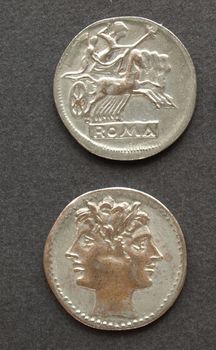 Ancient Roman coins on a black background