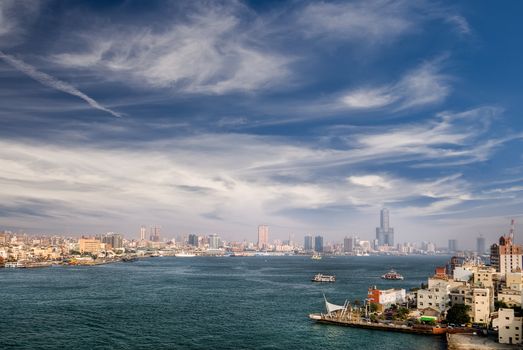 Harbor of modern city with famous skyscraper and boats in Kaohsiung, Taiwan.