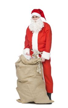 Santa claus with a sack og gifts isolated on a white background