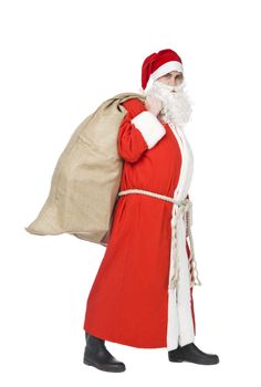 Santa claus with a sack of gifts isolated on white