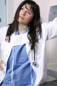 Thoughtful contemplative doctor in scrubs uniform.