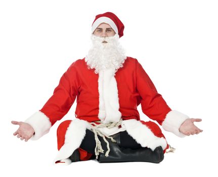 Meditating santa claus isolated on a white background