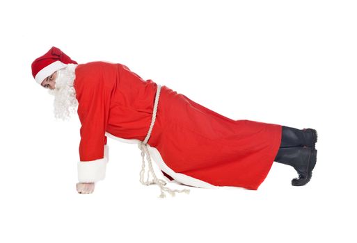 Santa claus doing push-ups isolated on a white background