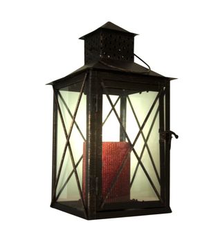 Light lantern with red candle over white background