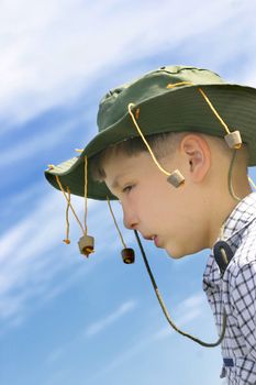 No fllies on me mate! Outback aussie boy wearing a cork hat - against vivid blue sky