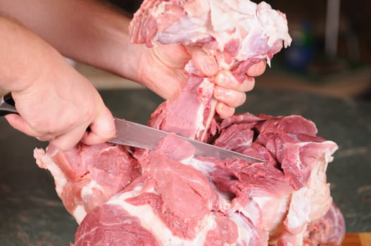 cutting of the big piece of meat