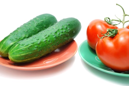 Red Tomatoes  and Two Cucumbers on Plate